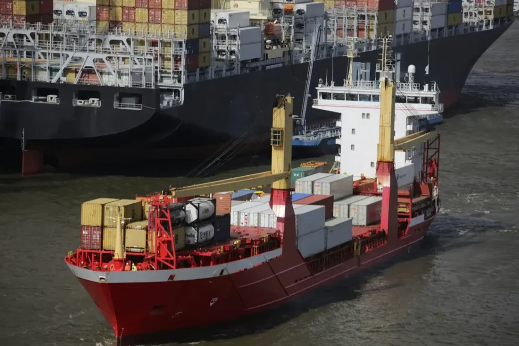 Cargo ship loaded with containers at a European port for heavy machinery export